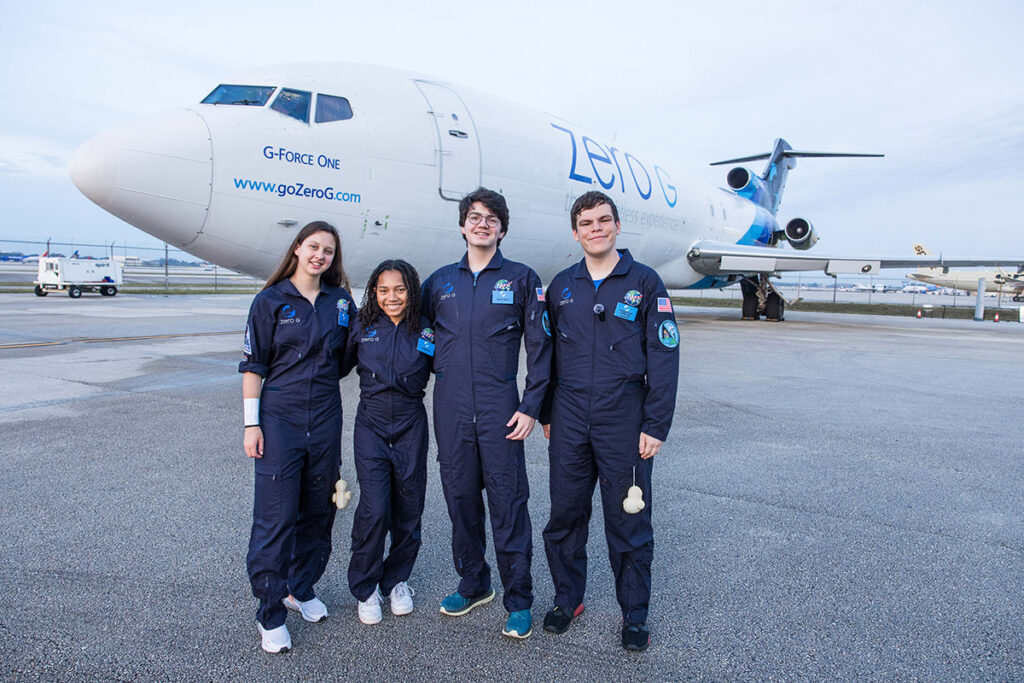 Group photo of NASA SEES Interns in front of Zero-G aircraft (L to R): Zoe Zlatic, Londyn Franklin, Landry McRoy, and Aaron Kingslien